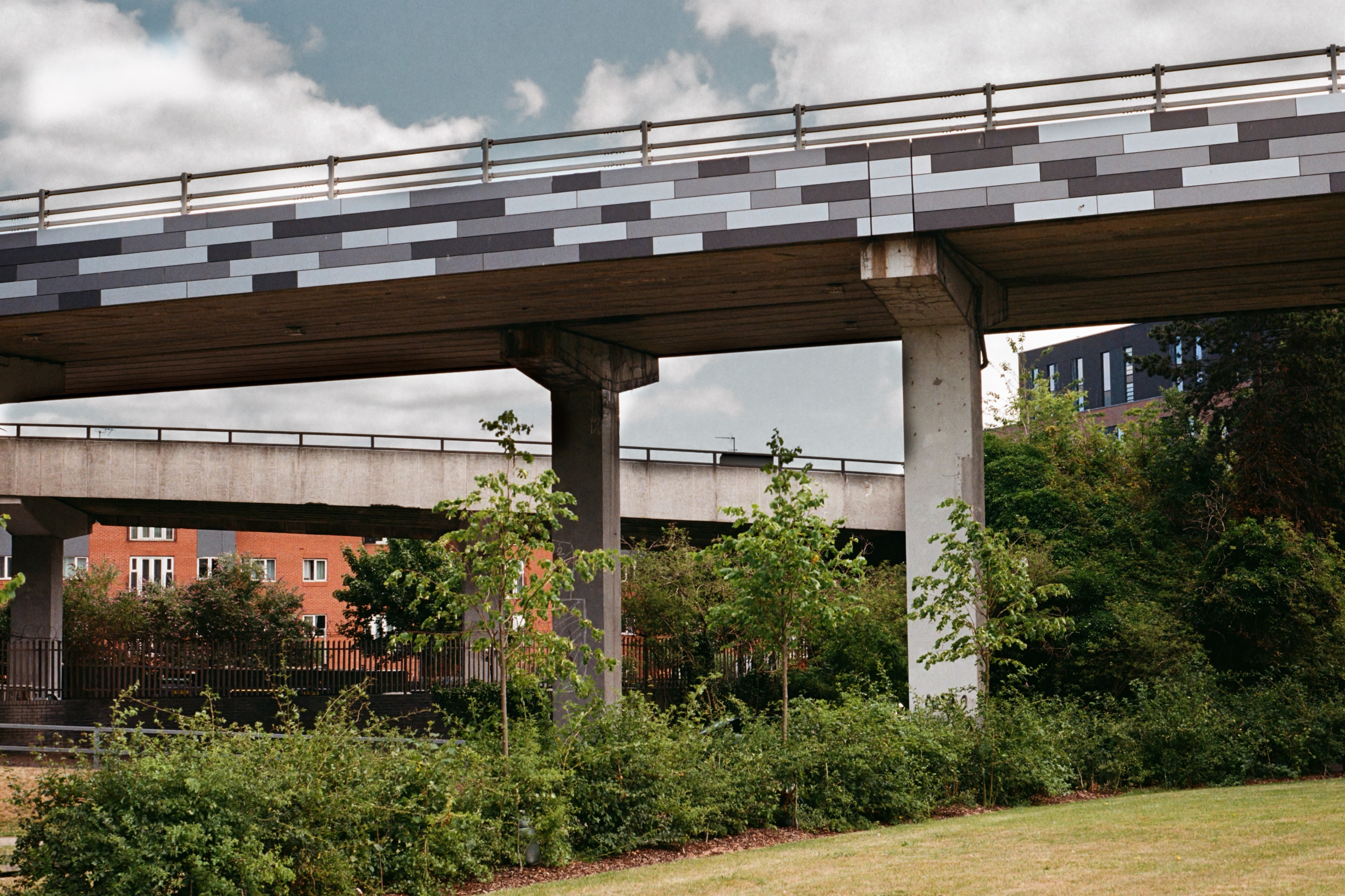 A slightly blurry, but pleasing, photograph of the acoustic tiling on the underside of the Coventry Ring Road on a grey day.